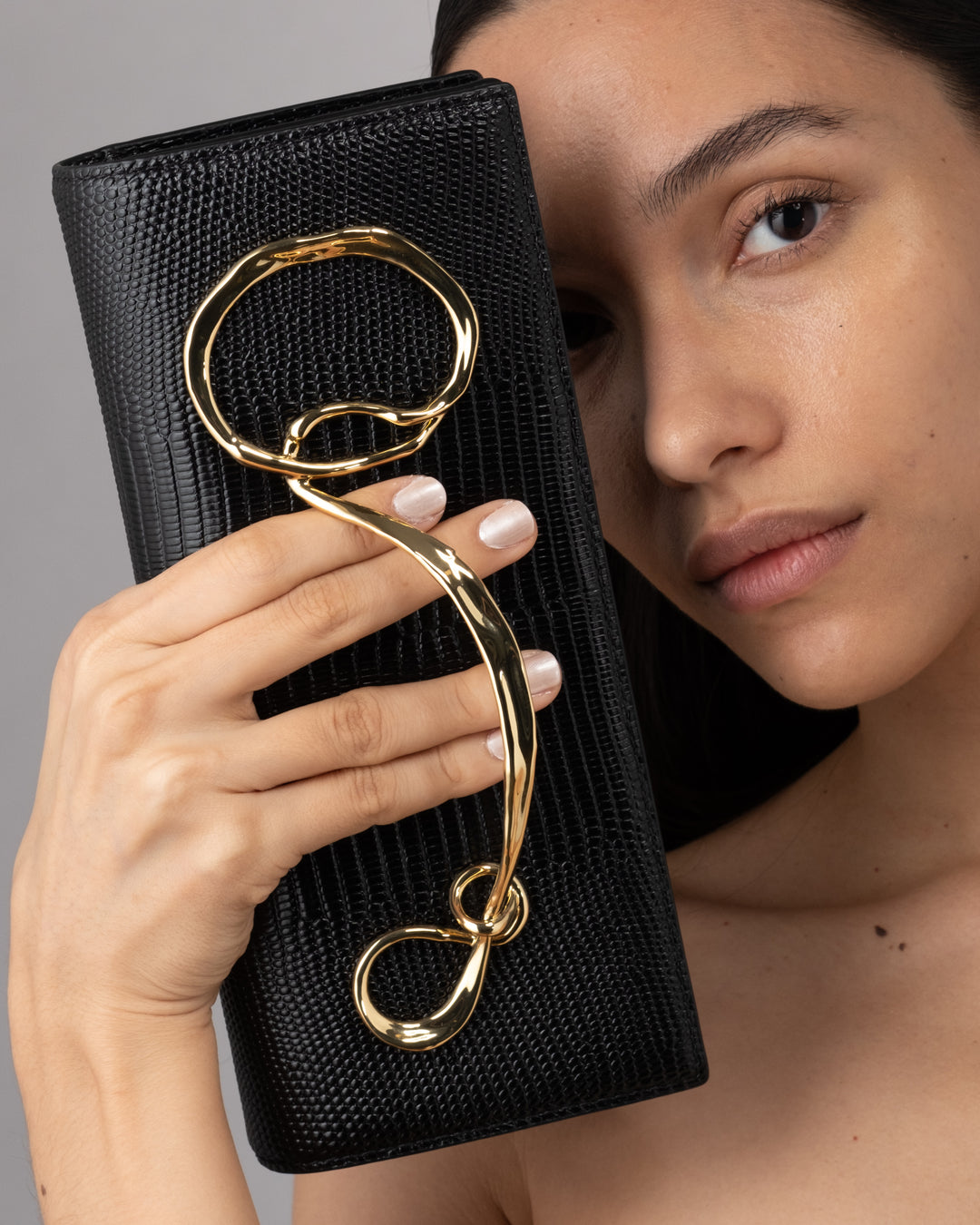 Twisted Gold Black Leather Clutch – ALEXIS BITTAR