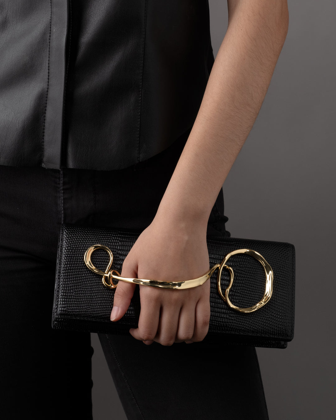Twisted Gold Black Leather Clutch ALEXIS BITTAR — free download